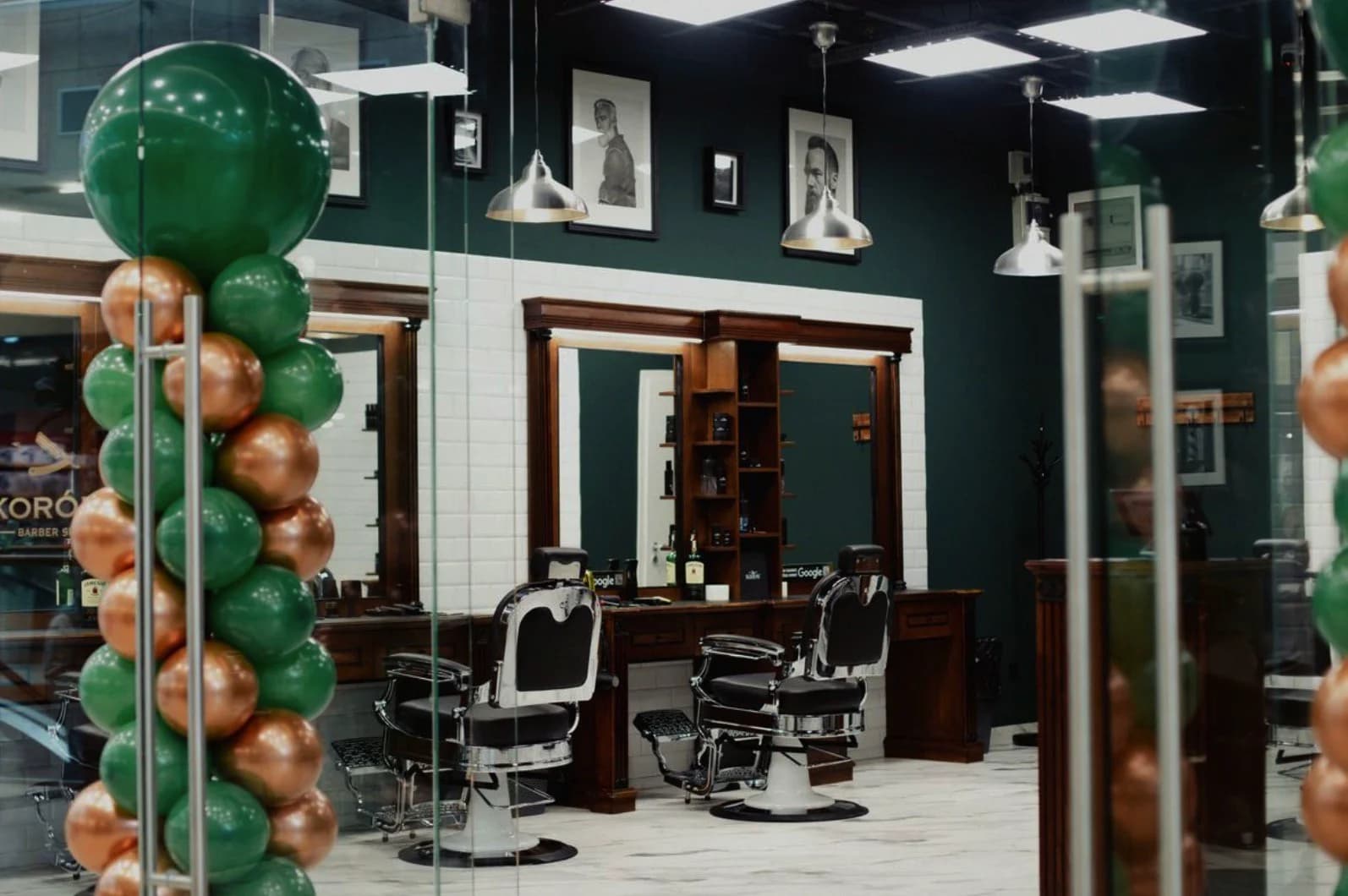 Salon interior with green and gold balloons
