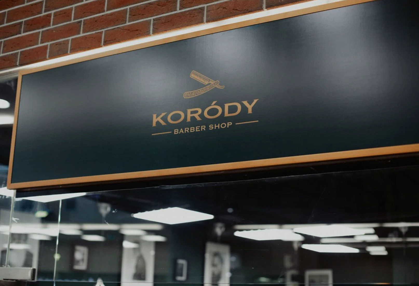 Koródy Barber Shop lettering on the salon wall